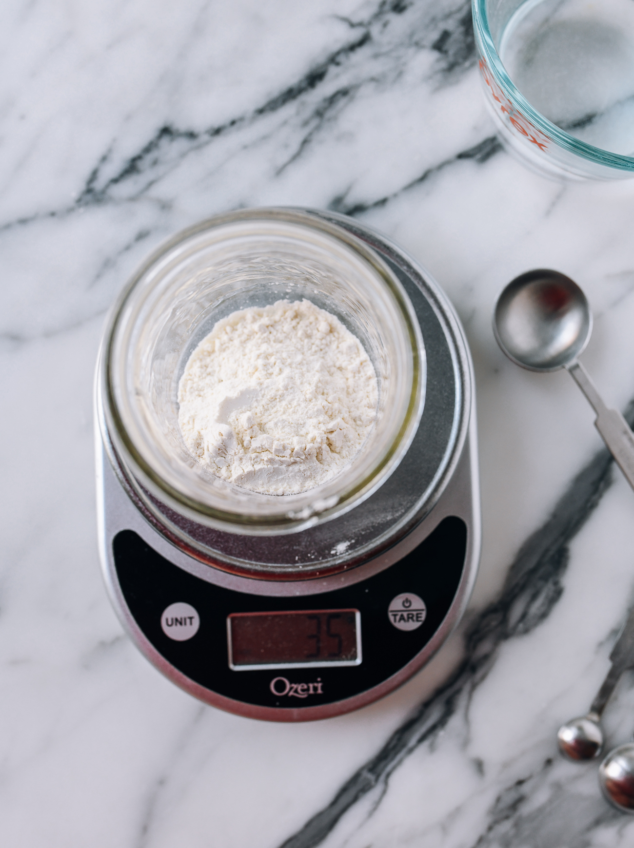 Measuring out 35g flour in jar