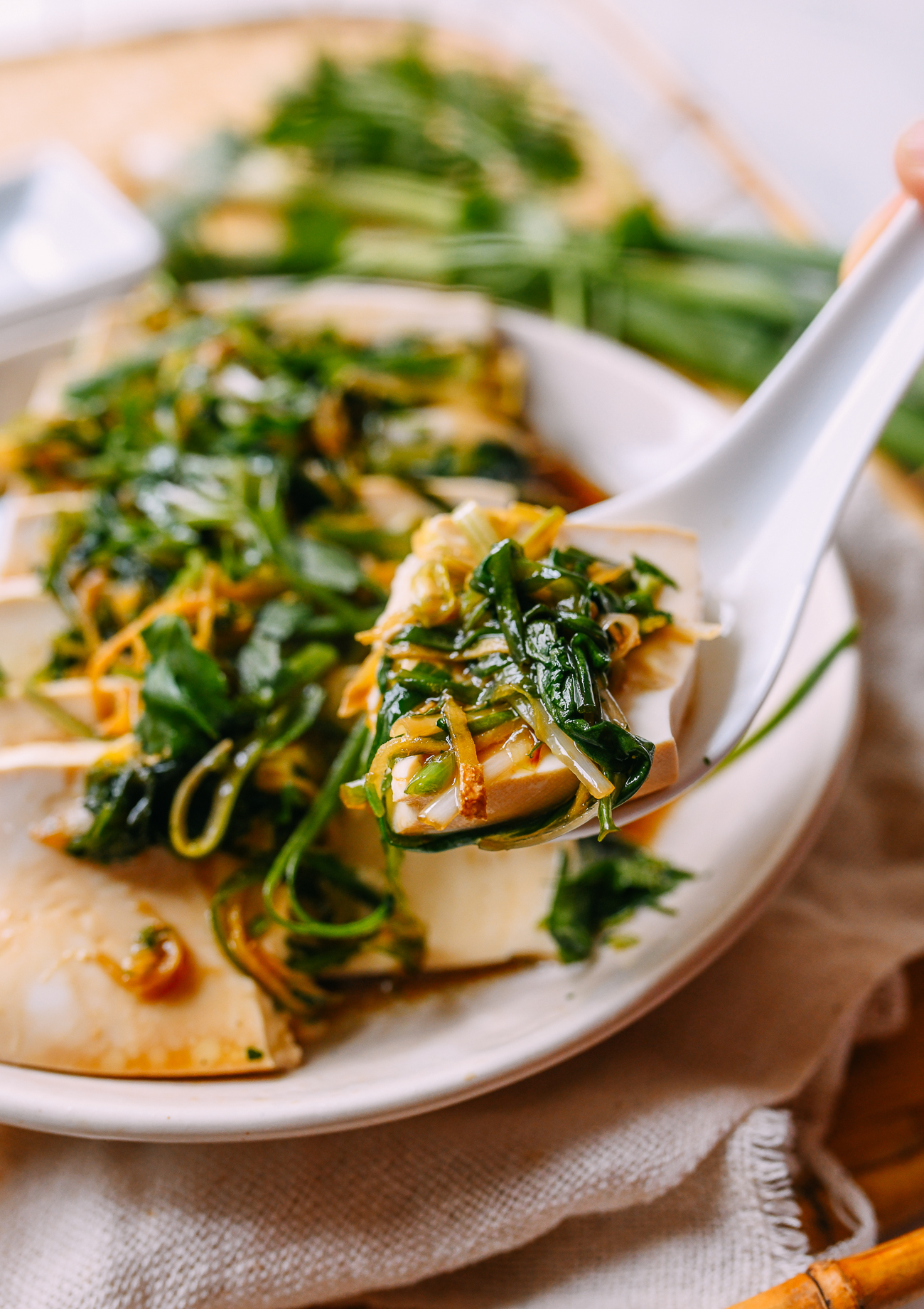 Steamed tofu with soy sauce, ginger, and scallions, inspired by steamed fish