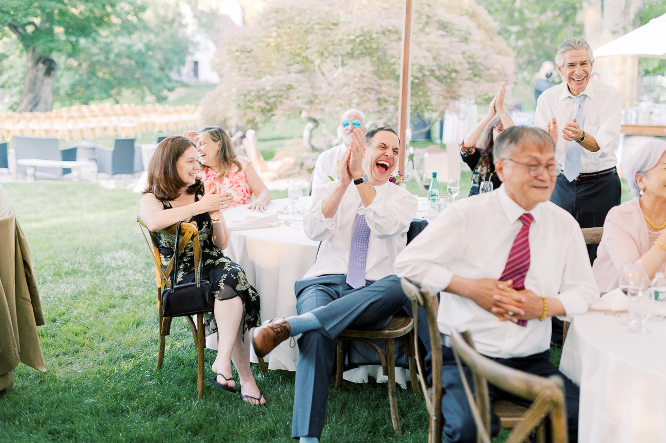 Wedding guests laughing