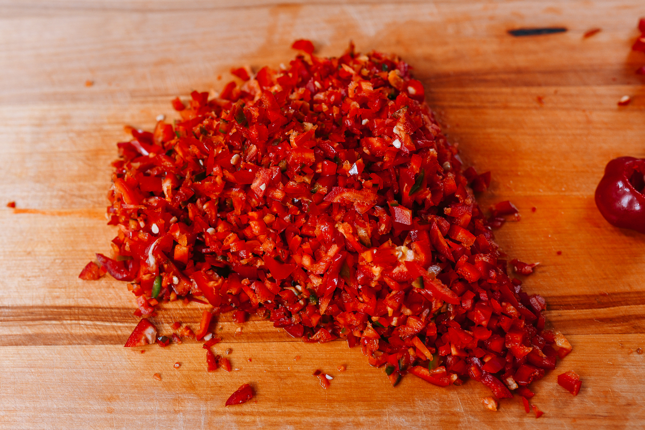 Chopped red chilies on cutting board