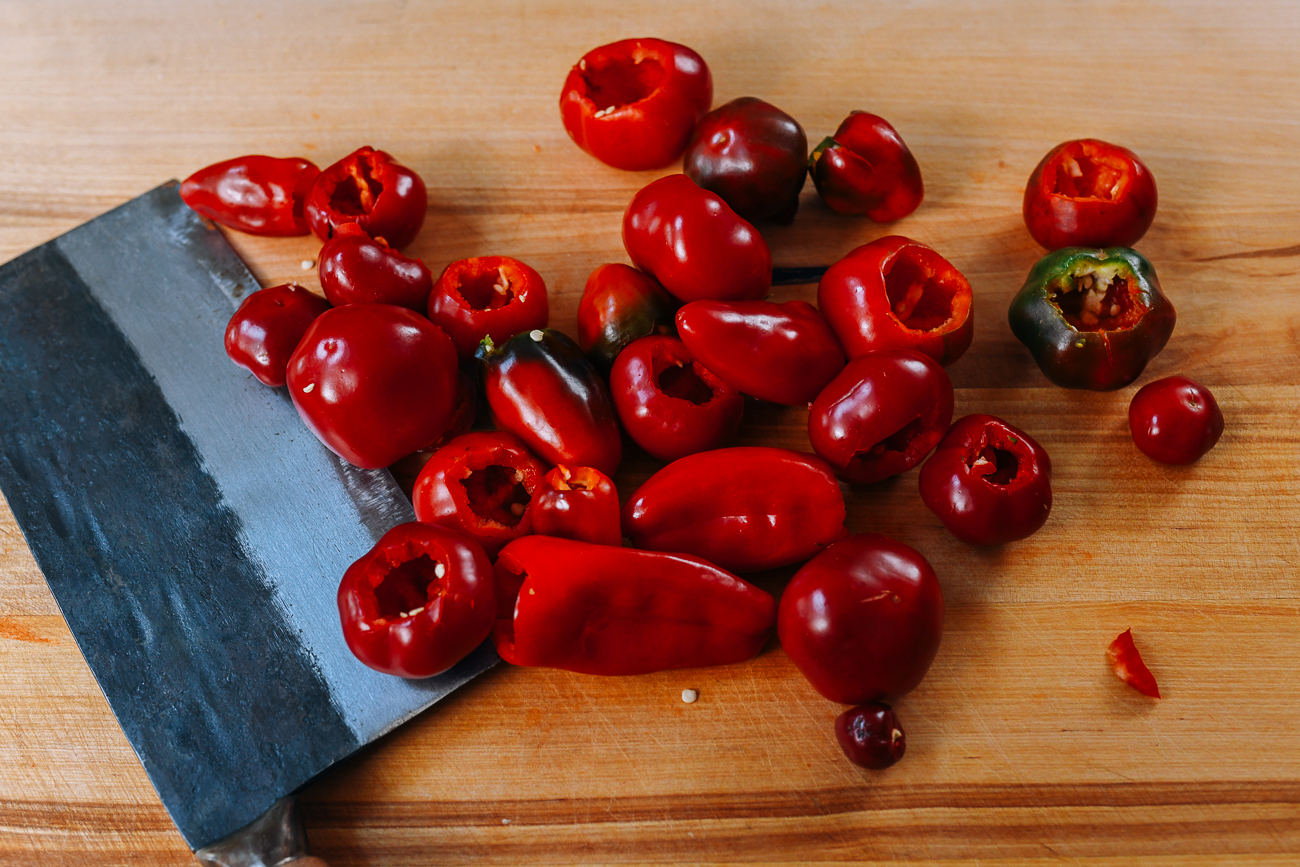 Red cherry and jalapeno peppers with seeds and stems removed