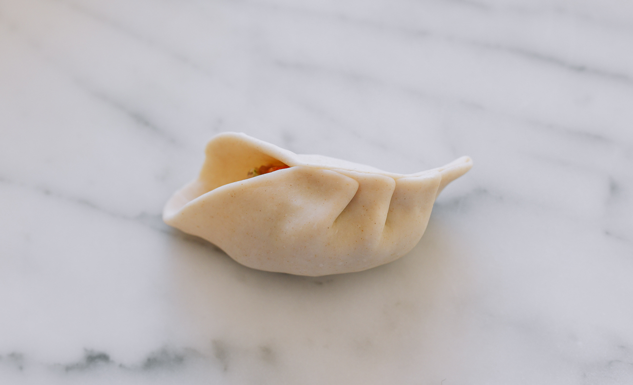 Pleating a Chinese dumpling