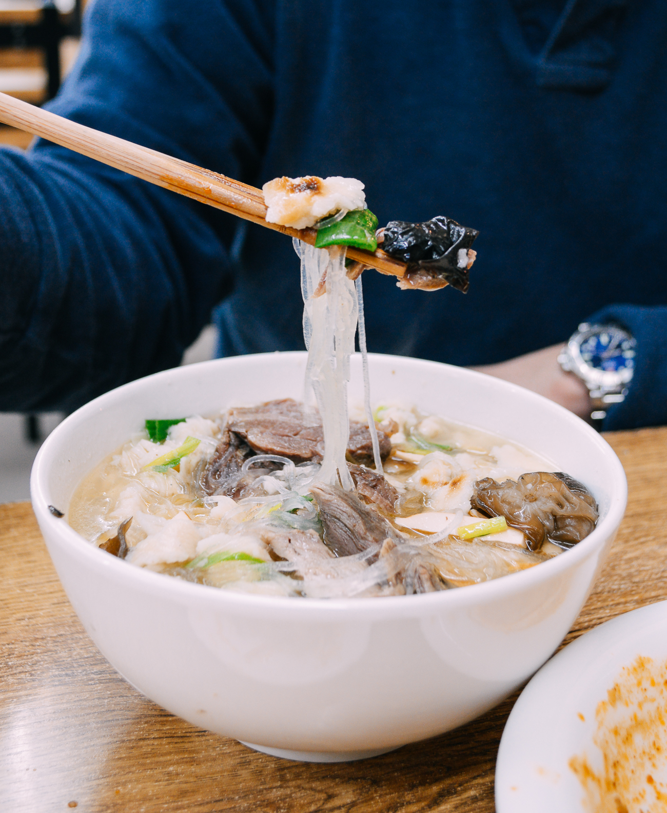 Bowl of yangrou paomo with wood ear and vermicelli noodles in Shaanxi