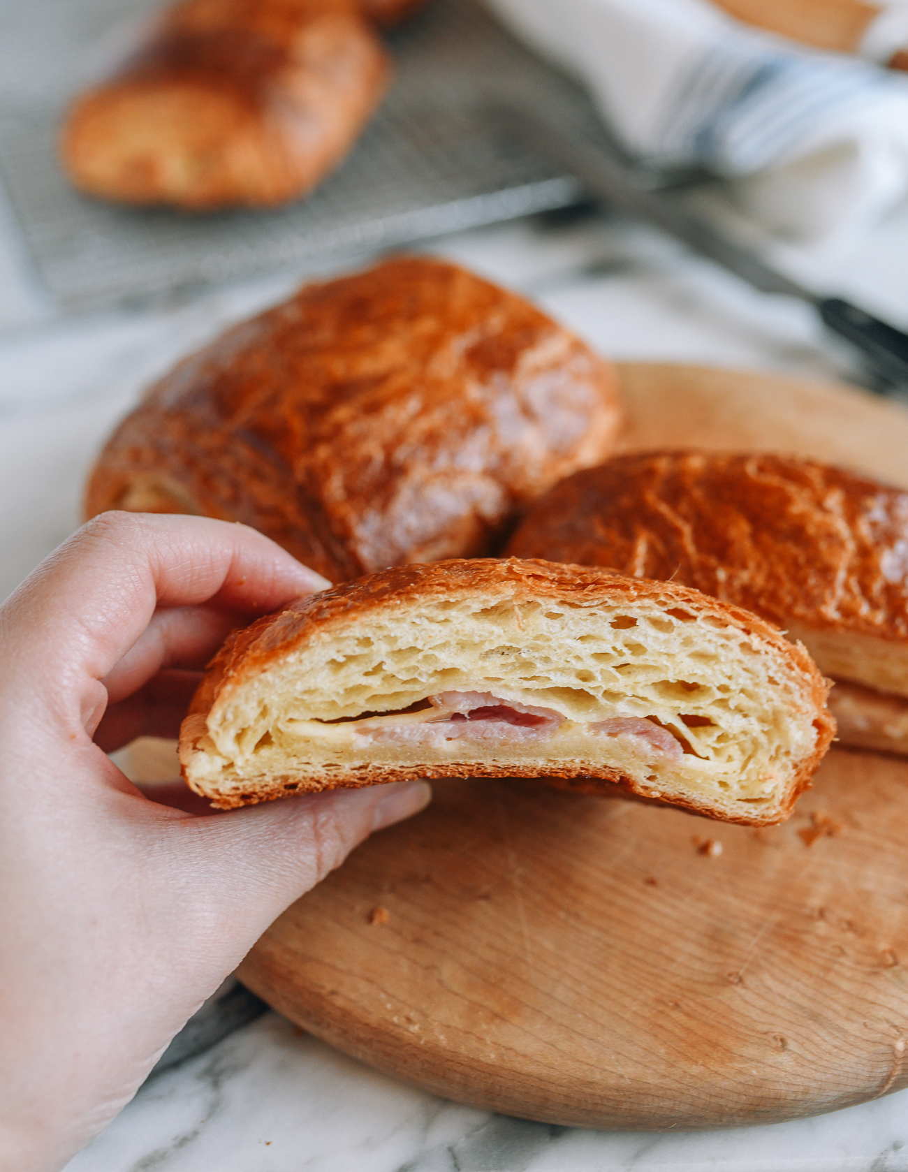 Enjoying a ham and cheese croissant