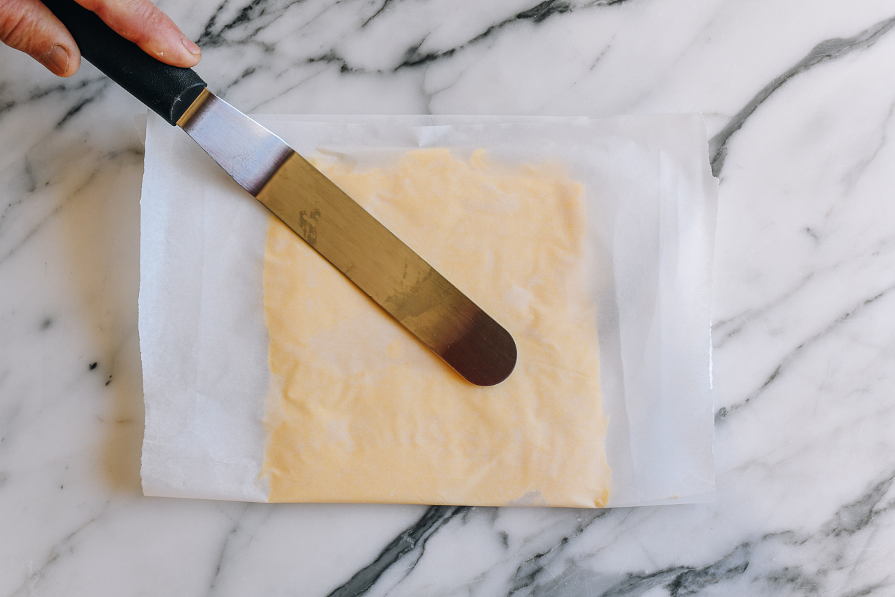 Flattening butter square using offset spatula