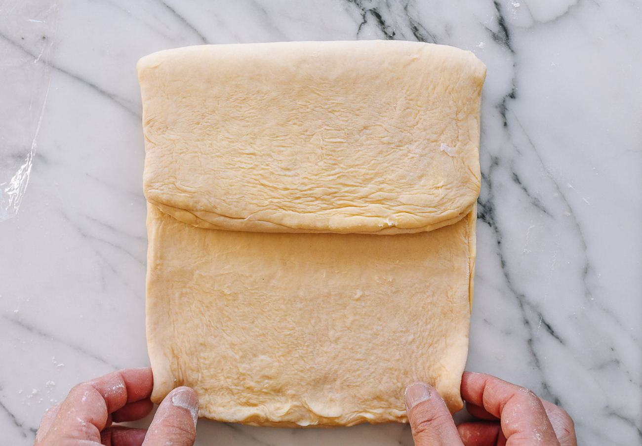 Folding croissant dough into thirds