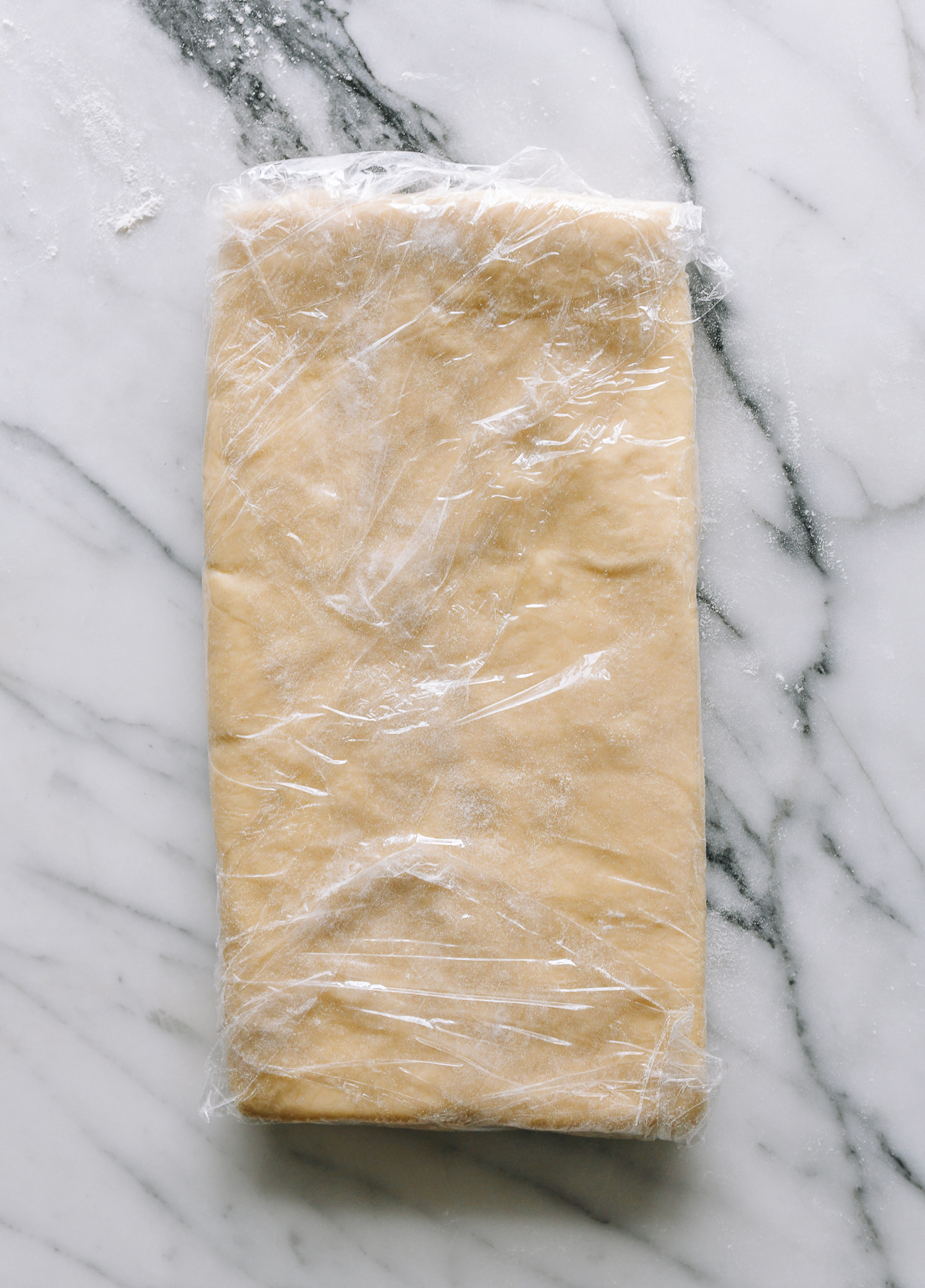 Croissant dough wrapped in plastic wrap