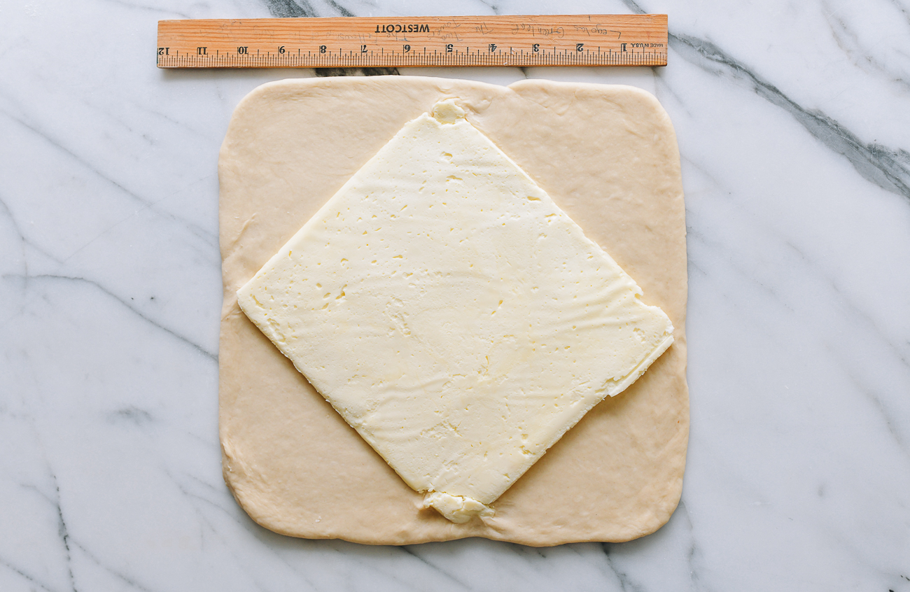 Butter square in middle of dough square