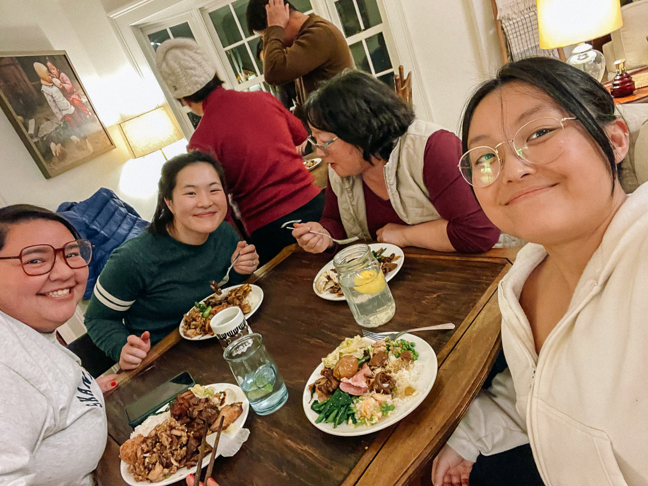Sarah, Kaitlin, and family enjoying dinner