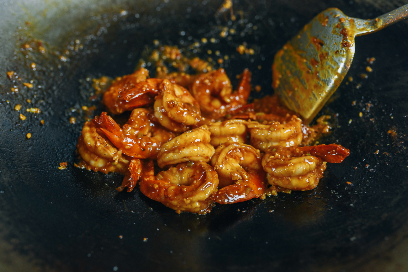 Tossing tiger shrimp in chili garlic sauce mixture