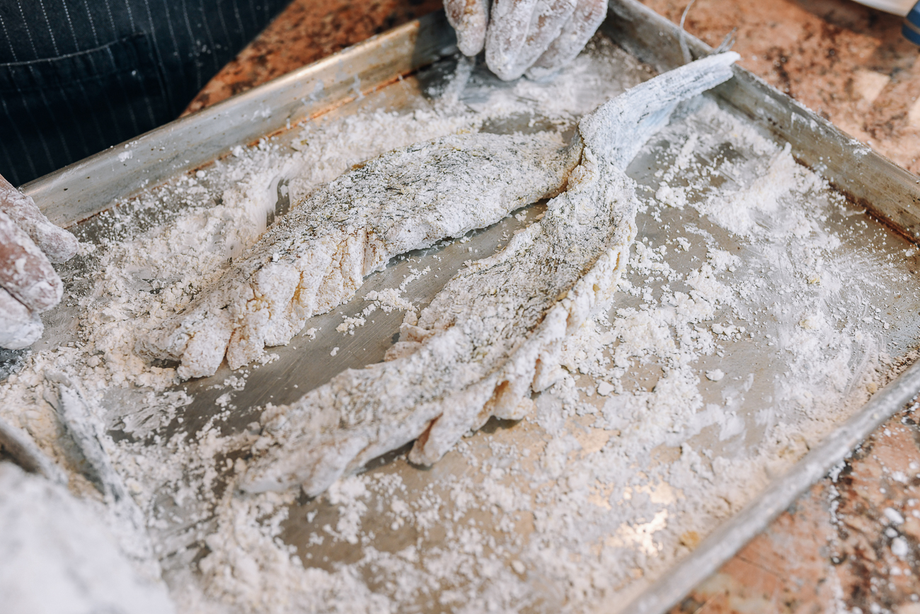 Sea bass fillets dredged in cornstarch