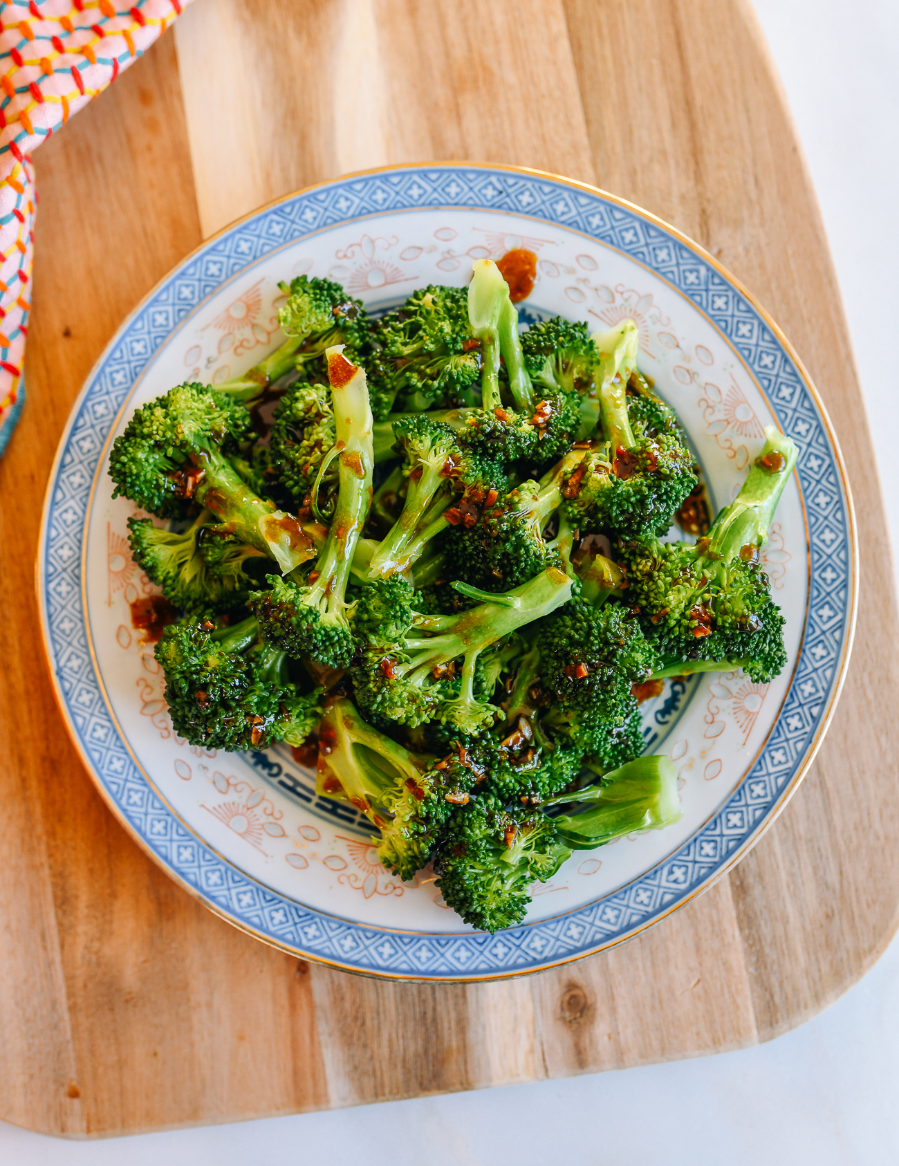 Plate of Steamed Broccoli Drizzled with sauce