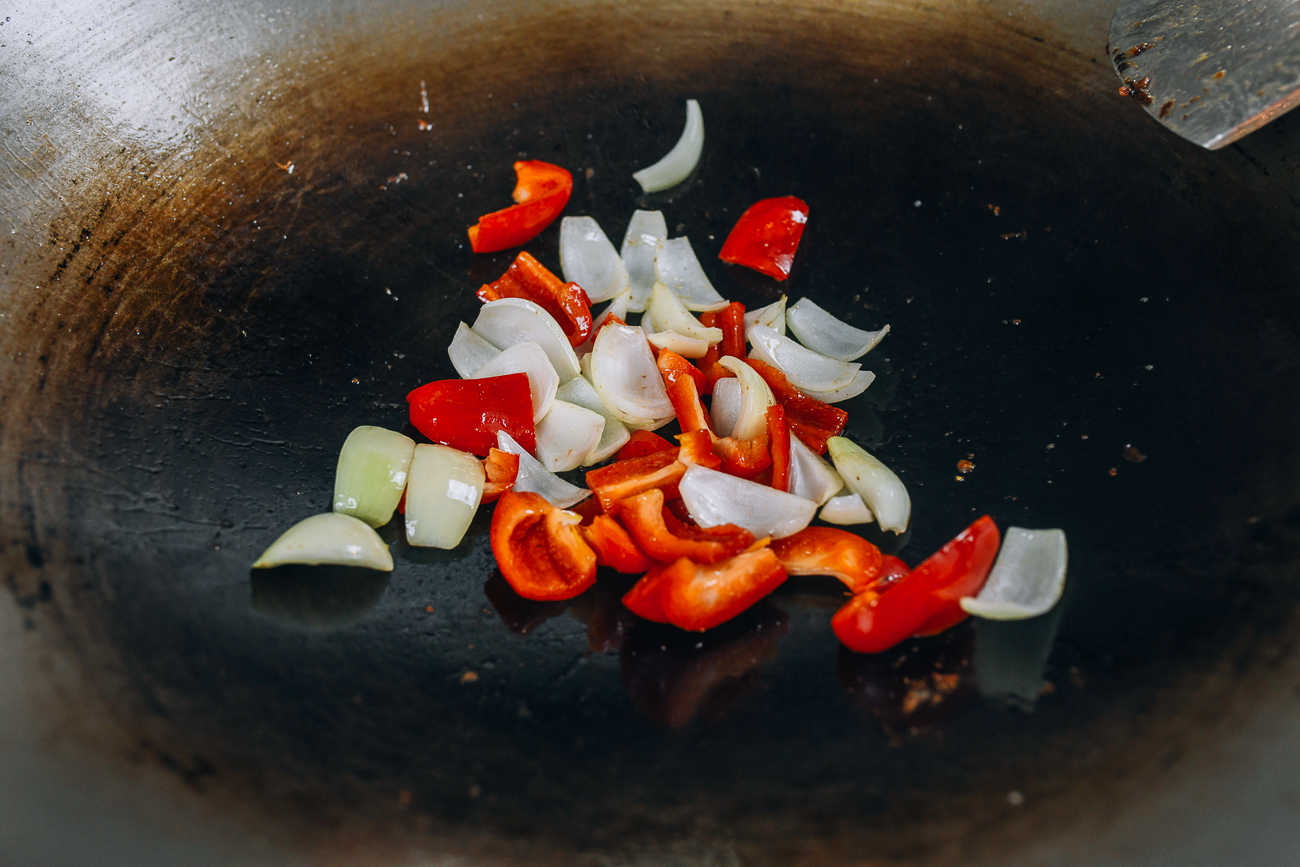 Bell pepper and onions in wok