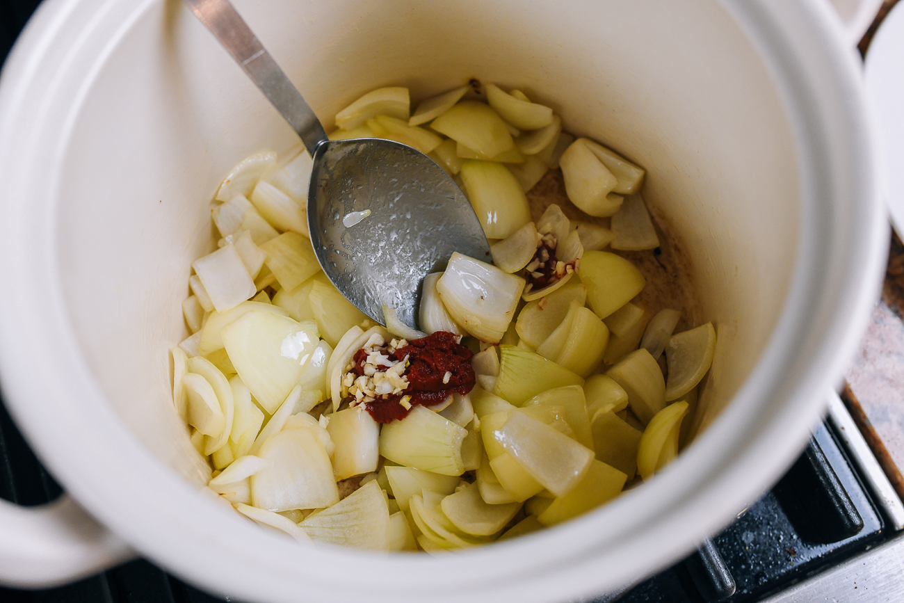 cooking onion with tomato paste, garlic, and worcestershire