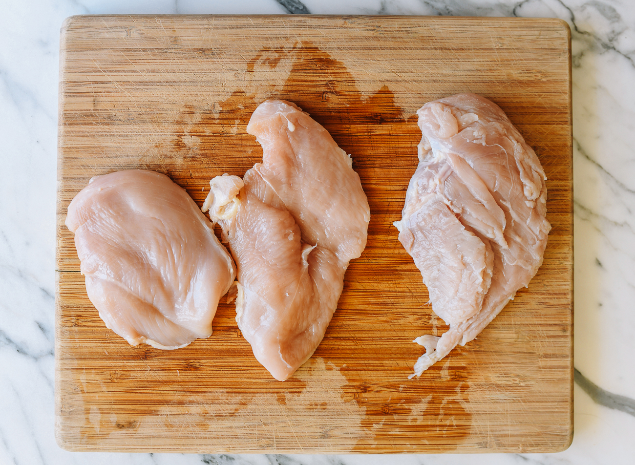 chicken breast on cutting board