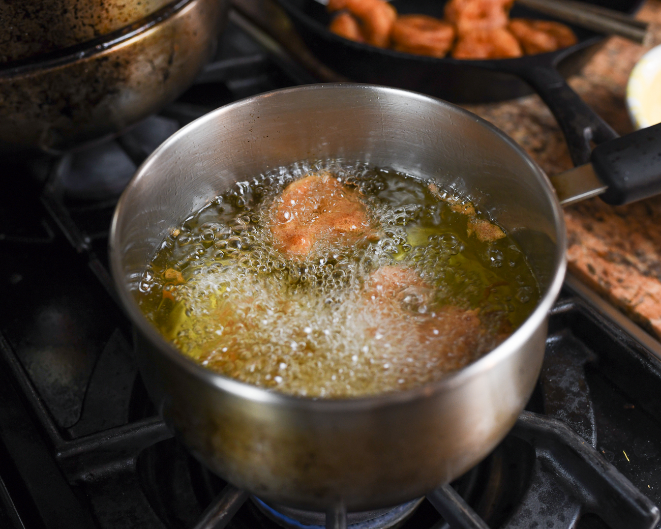 frying shrimp in small pot of oil