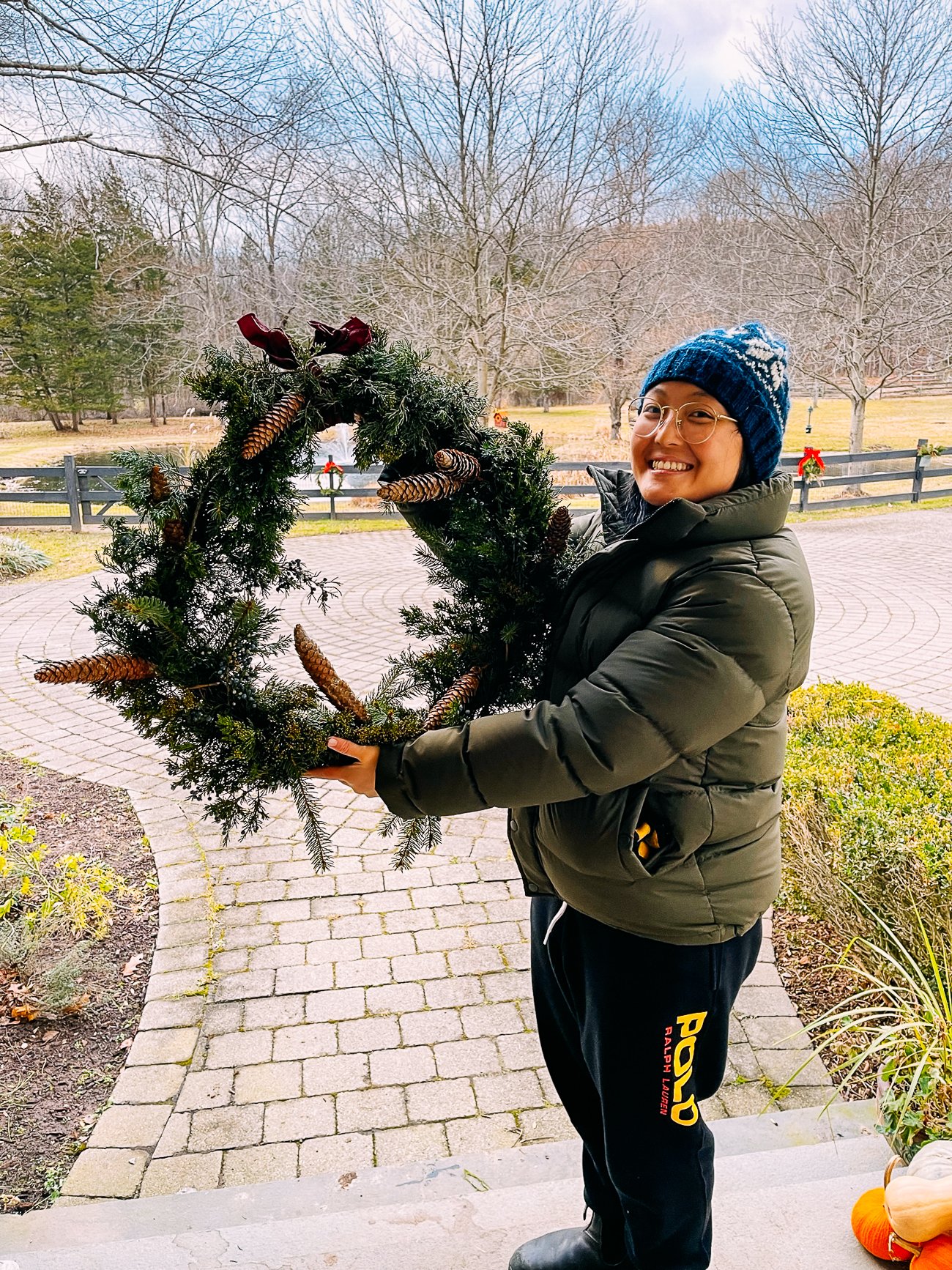 Kaitlin holding up wreath