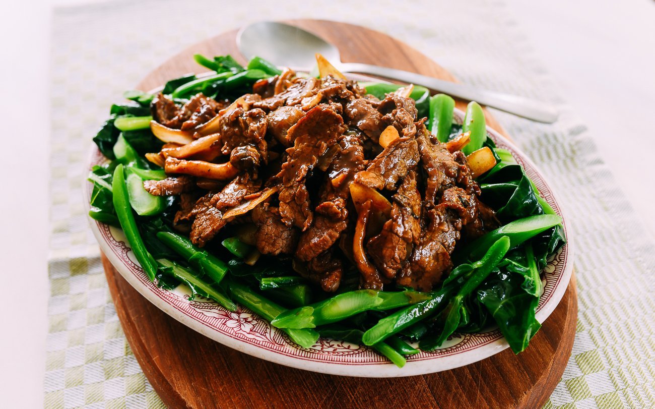 beef with oyster sauce on a bed of Chinese broccoli