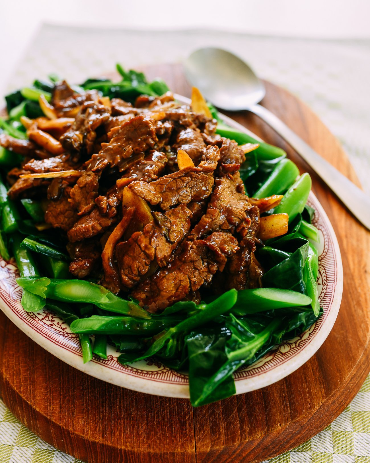 Beef with oyster sauce on a bed of Chinese broccoli