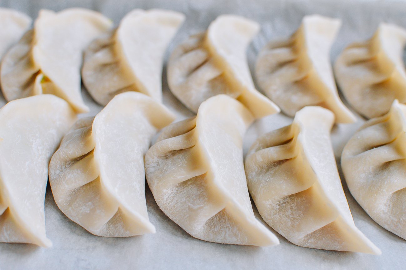 dumplings lined up on sheet pan