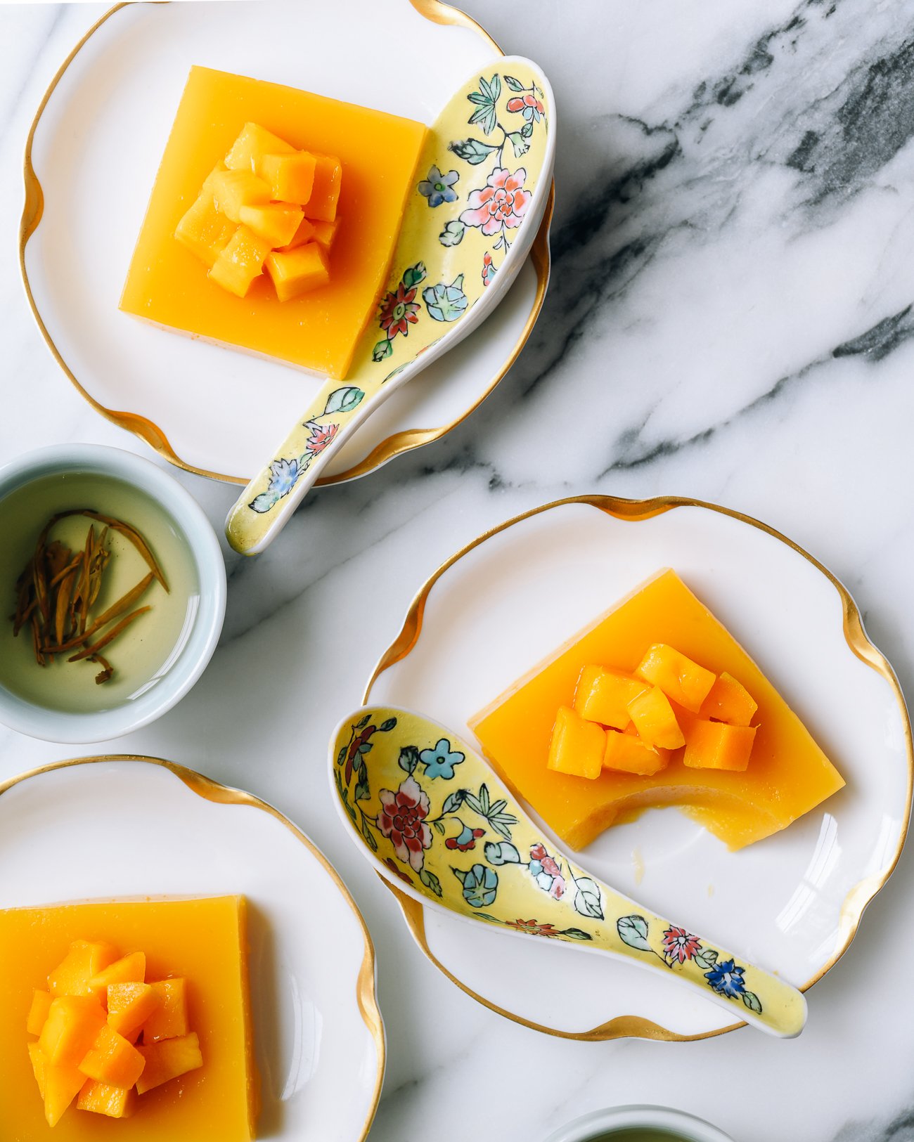 plates with squares of mango pudding