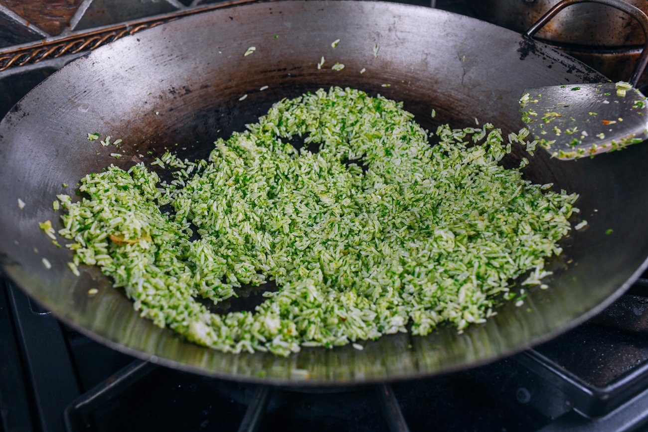 scallion rice spread in single layer of wok