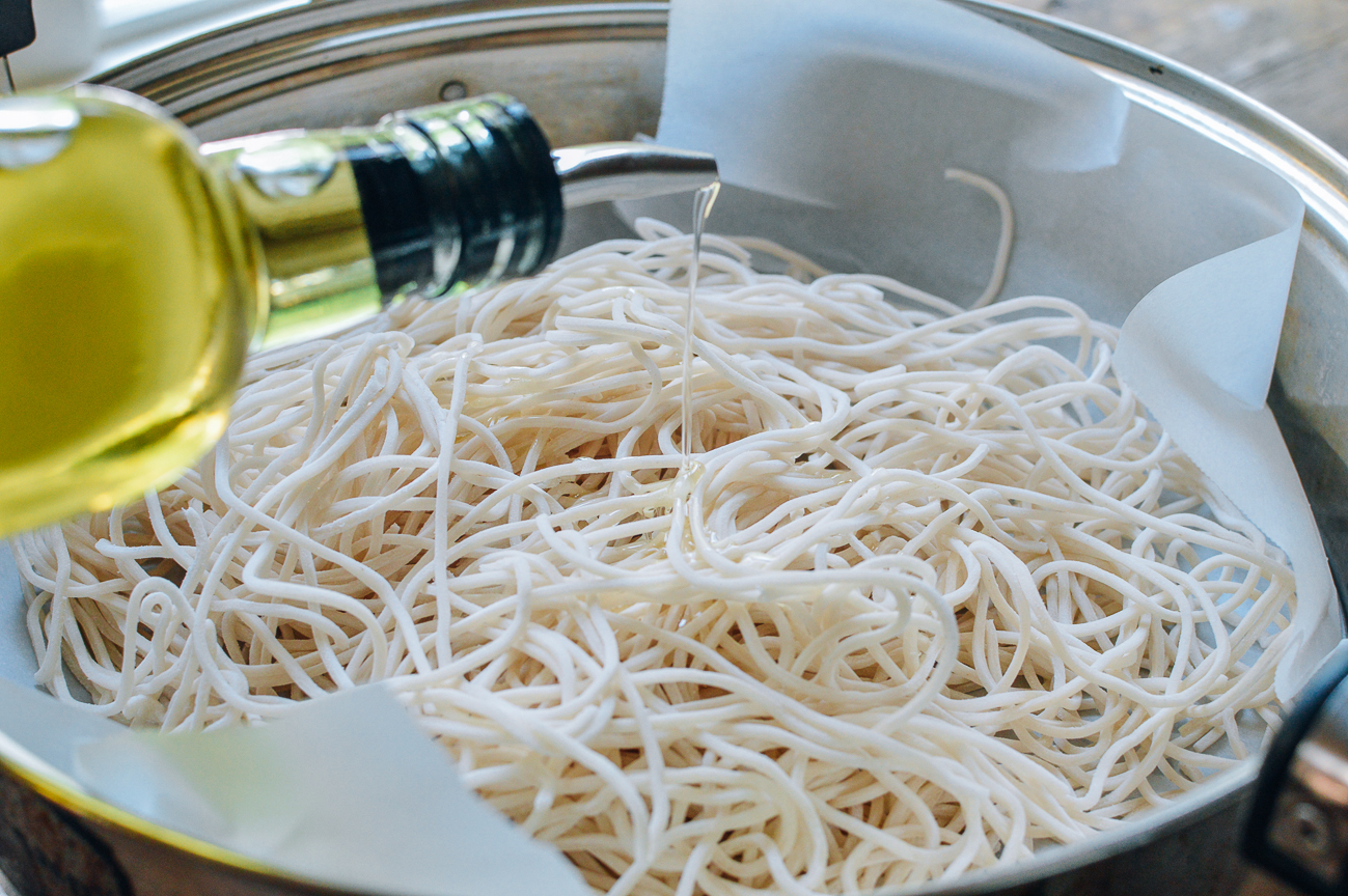 oiling noodles in steamer