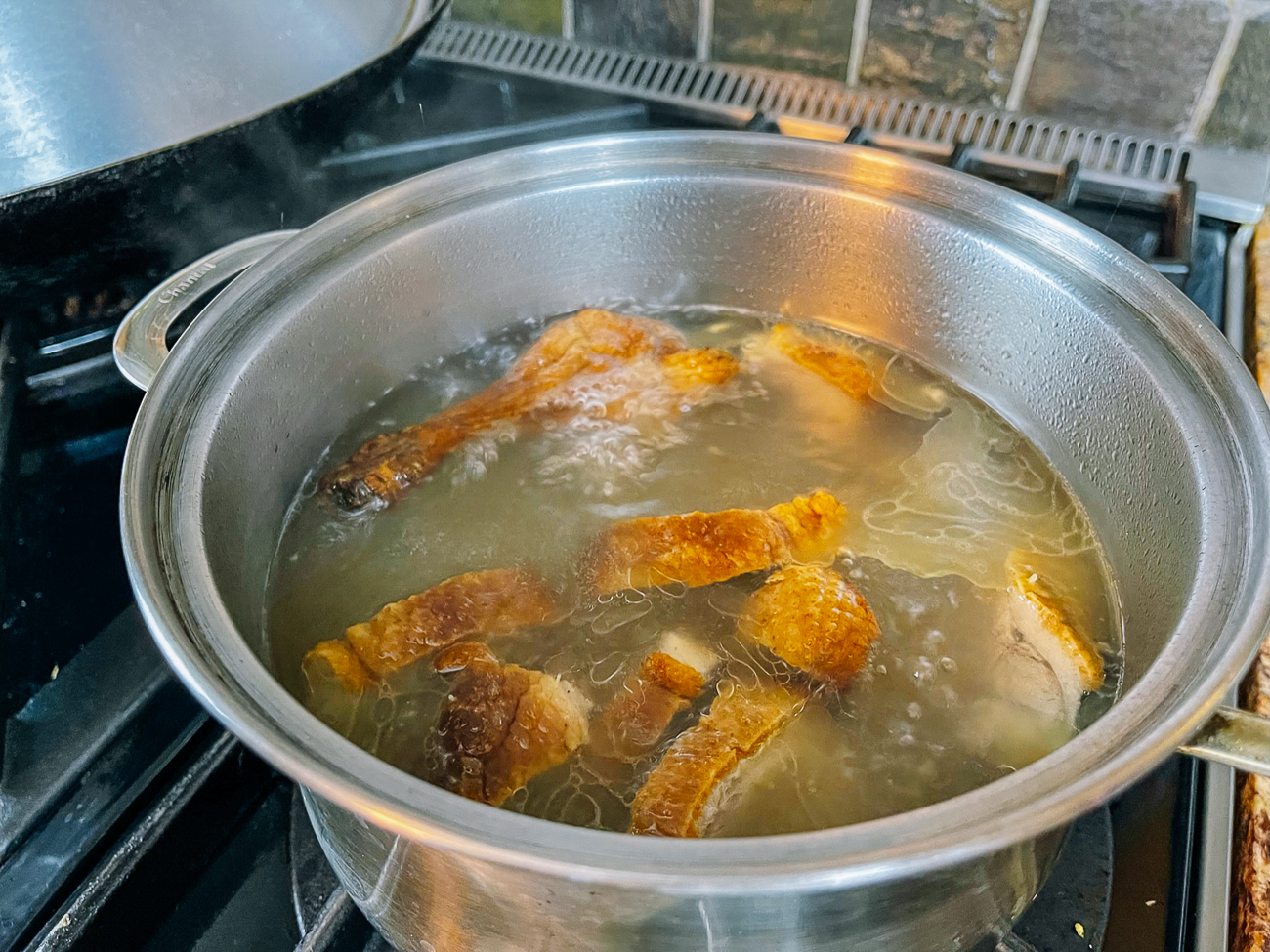 making roast duck noodle soup