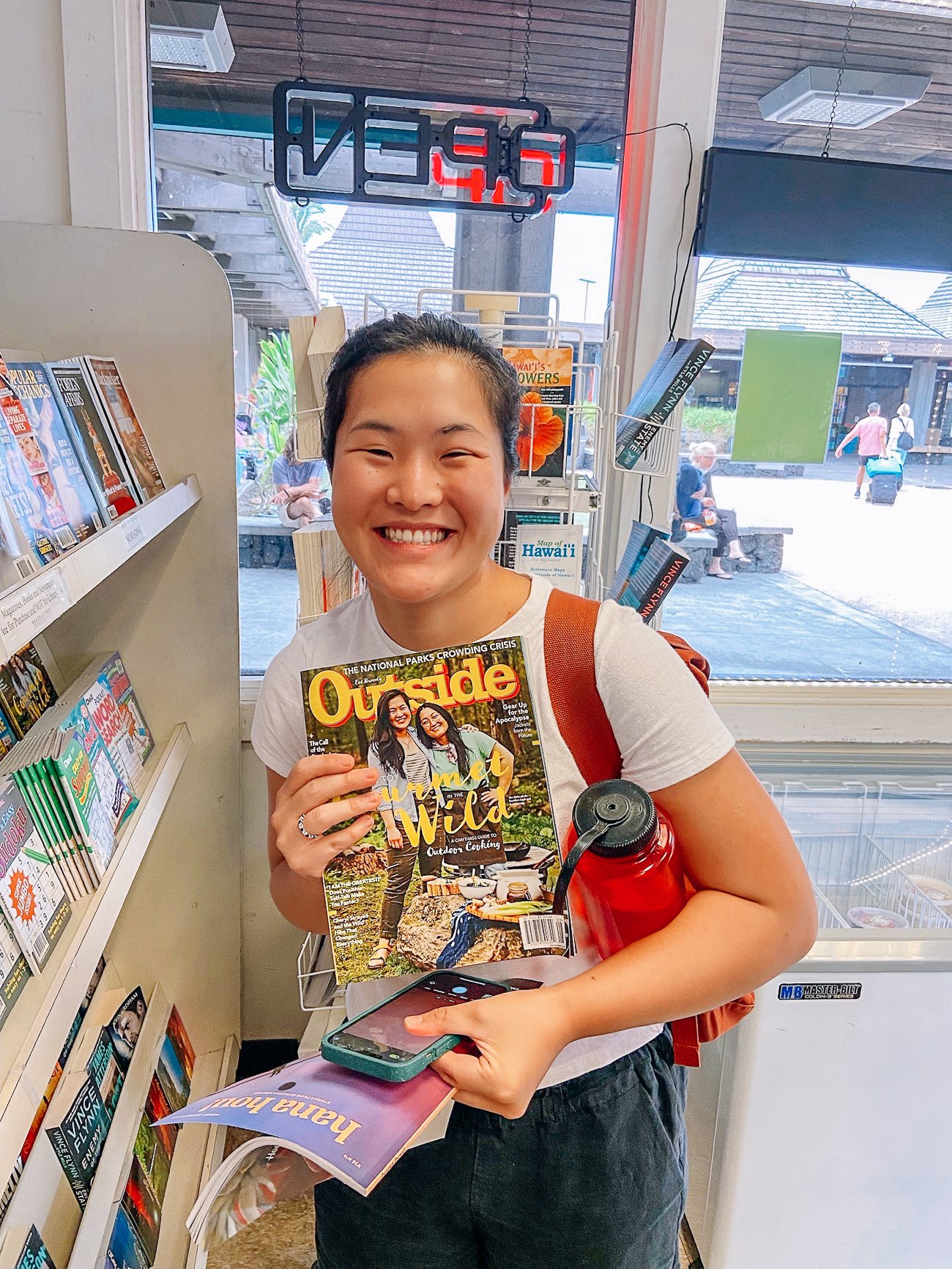 Sarah holding July/August 2022 issue of Outside magazine