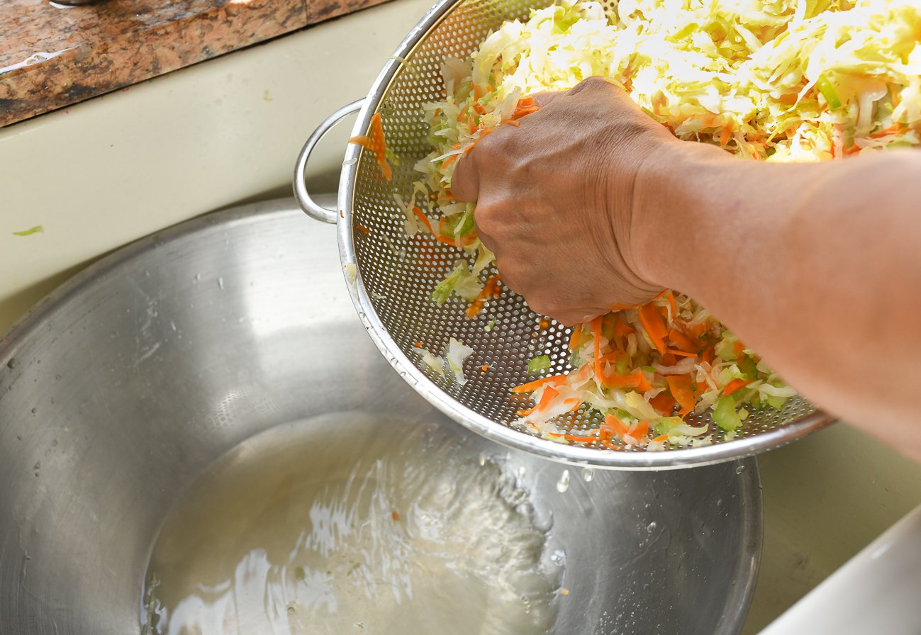 draining cabbage, carrots, and celery