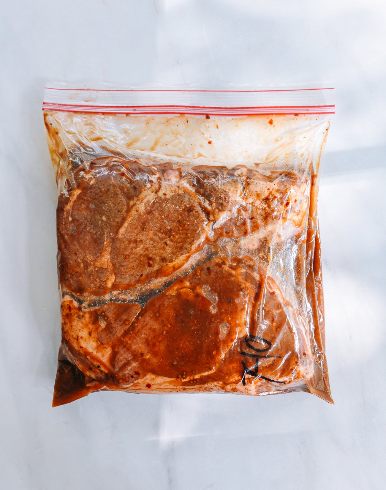 marinated steak in ziplock bag