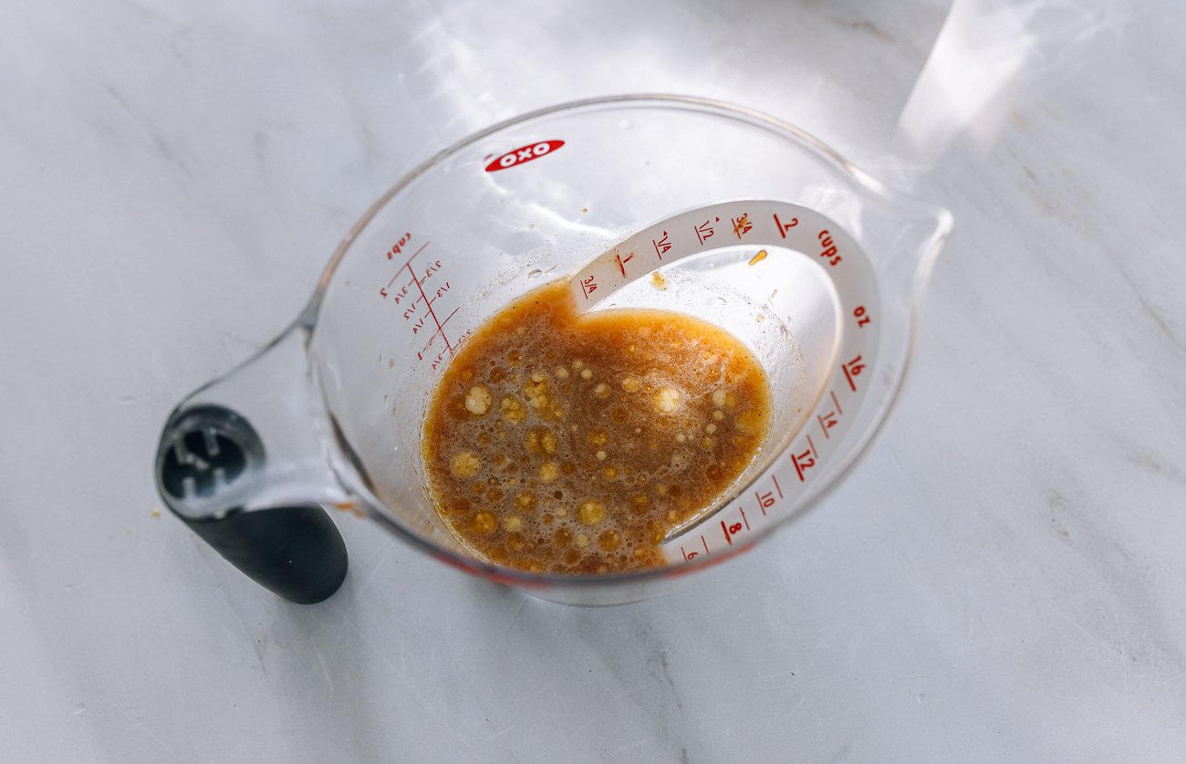 sauce mixture in measuring cup