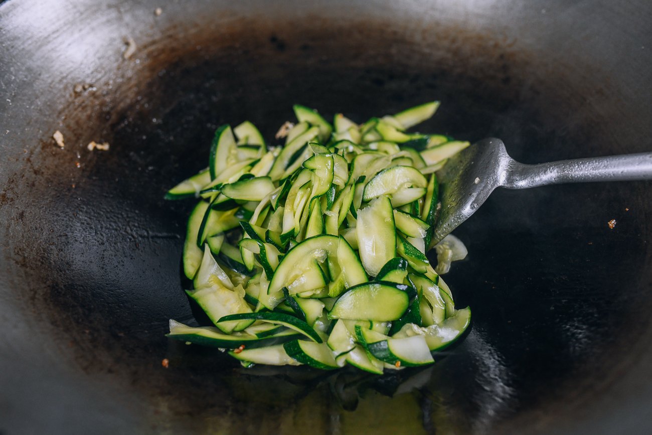 zucchini slices in wok