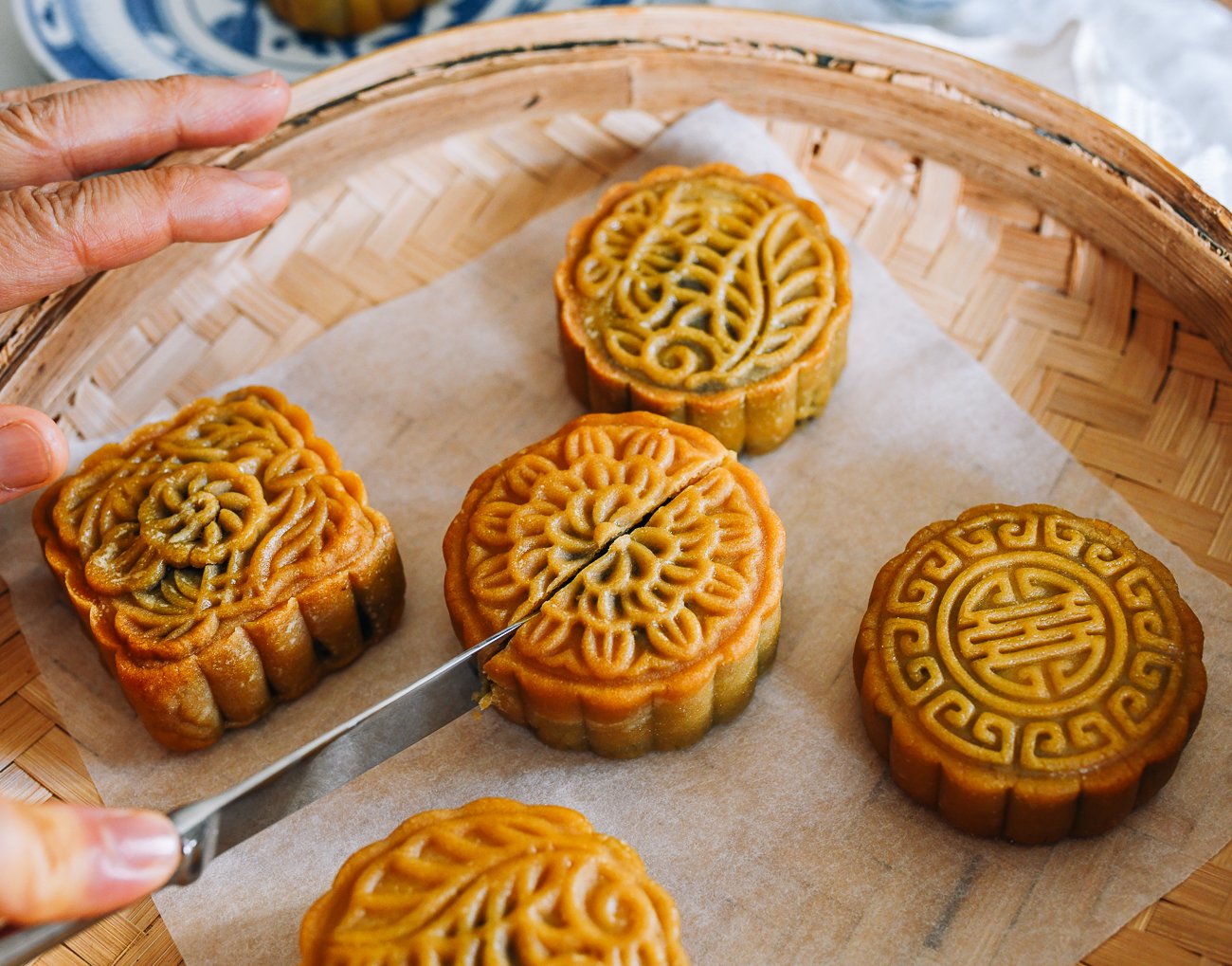 slicing into red bean mooncake