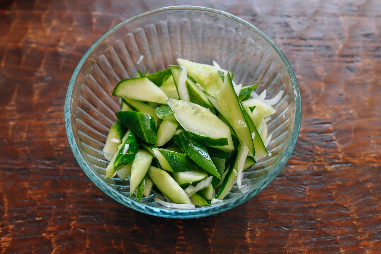 bowl of salted cucumber and onion