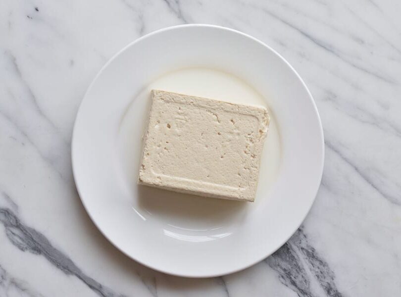 block of firm tofu on a plate