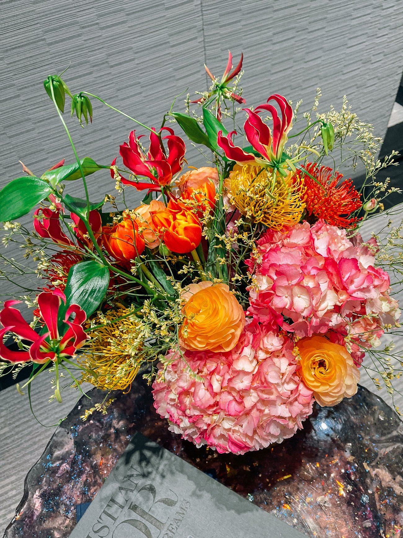 Exotic flower arrangement of pinks, oranges and reds 