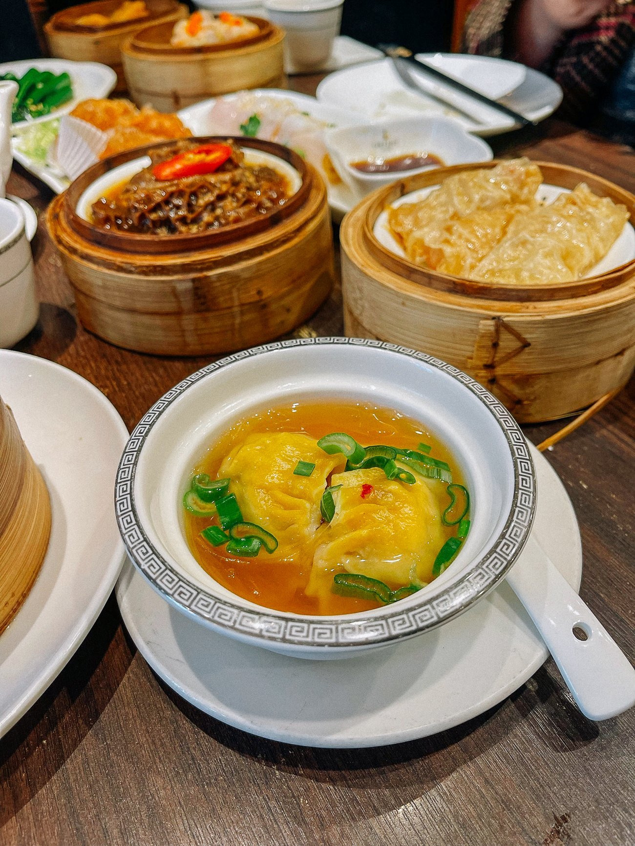 two dumplings in a small bowl of soup