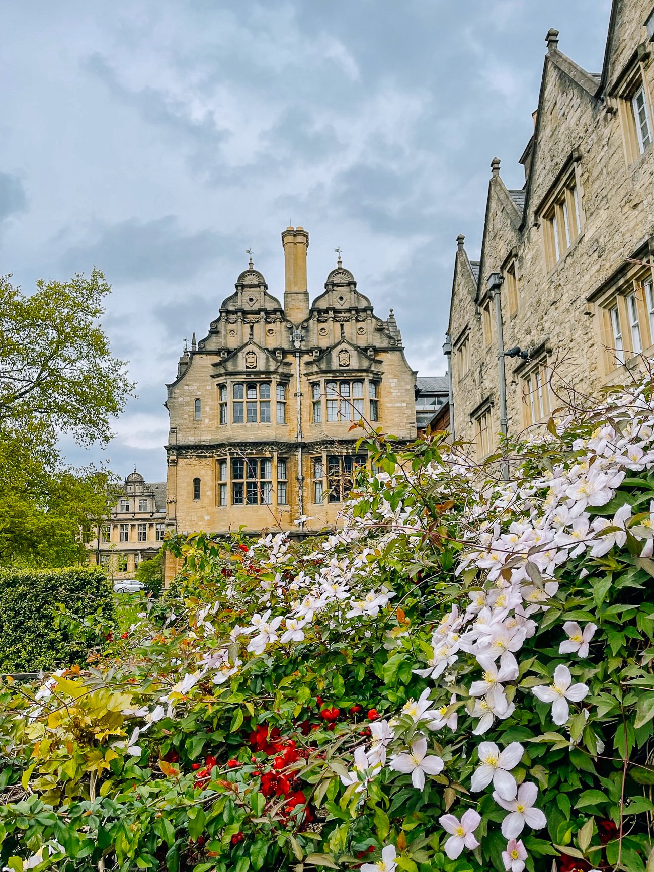 Oxford University building with flowers
