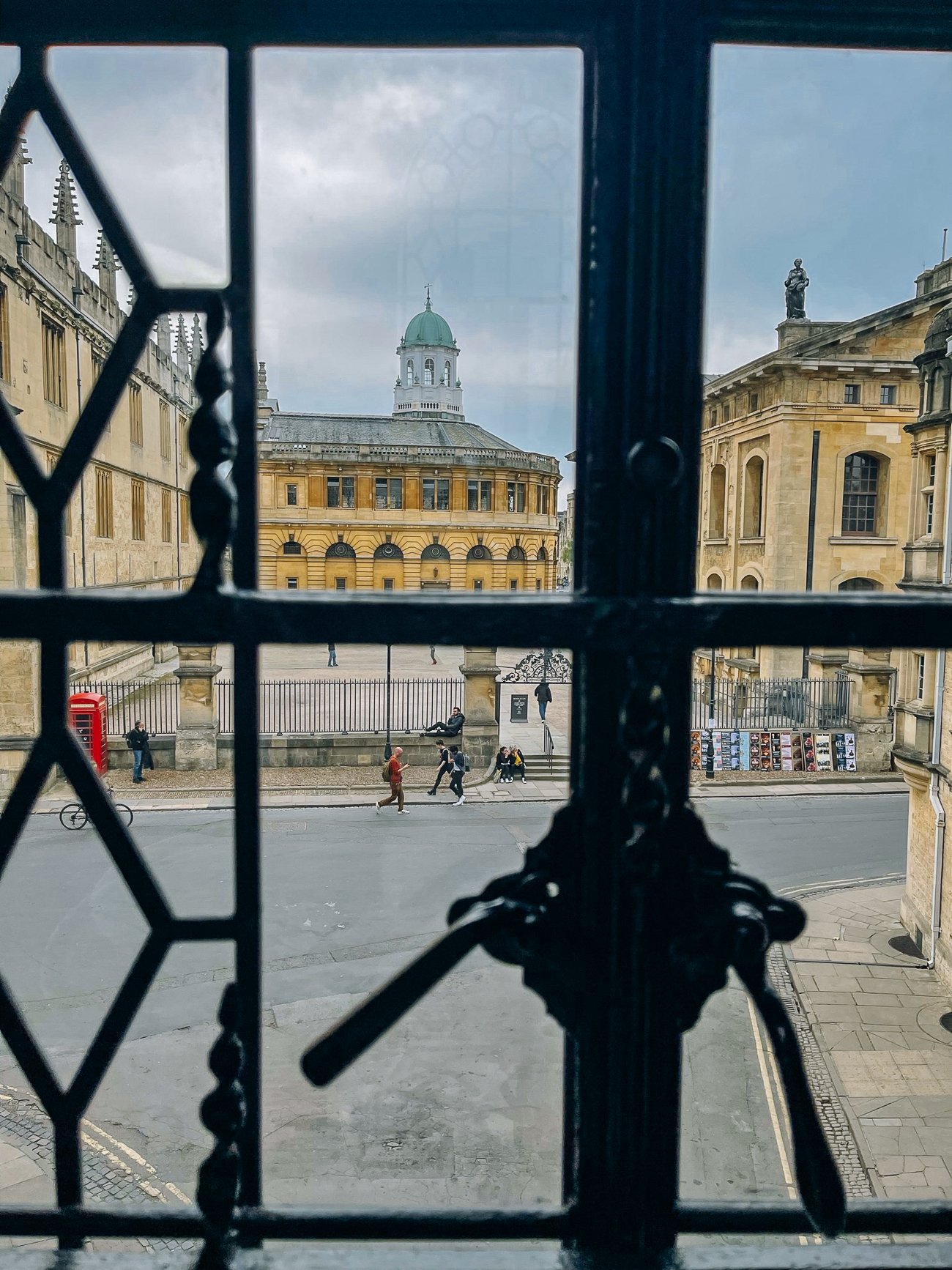 the view of the Sheldonian Theatre through at window at Oxford College