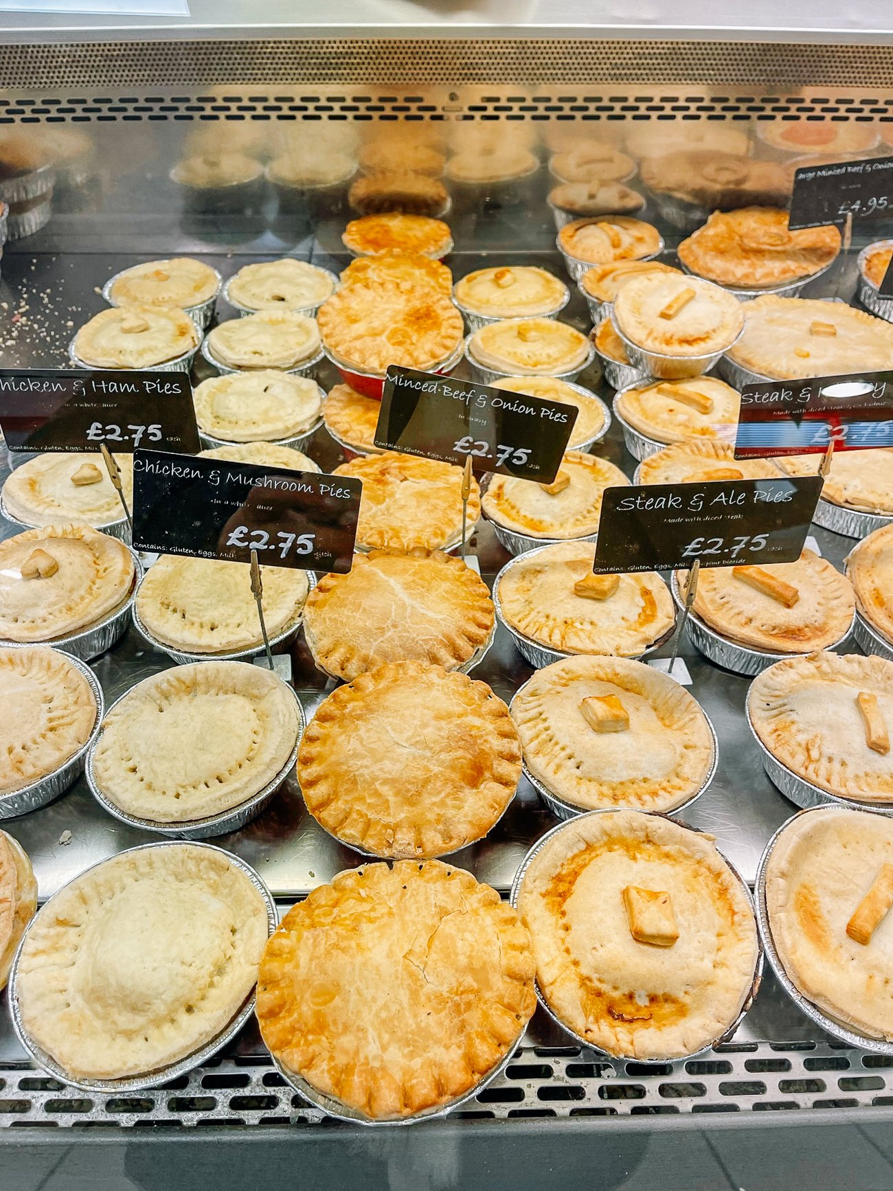 Meat pies under glass at Oxford Covered Market