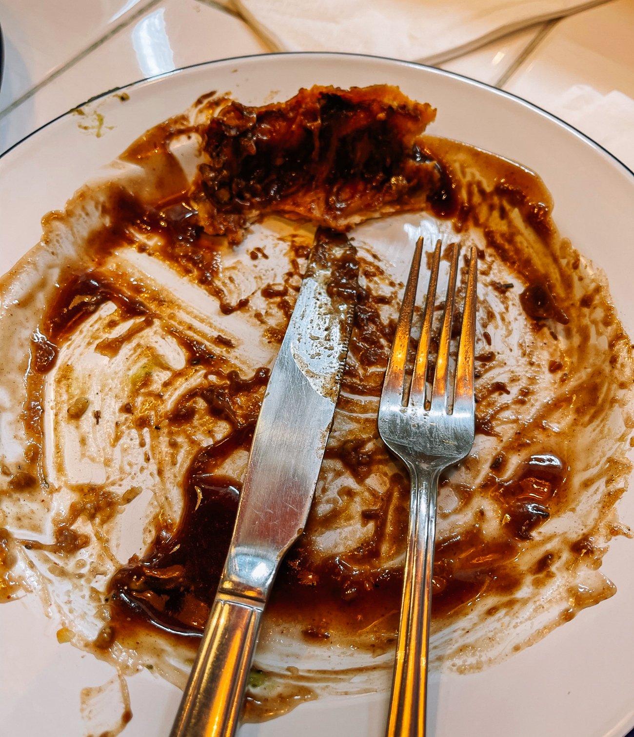 Empty plate with brown gravy