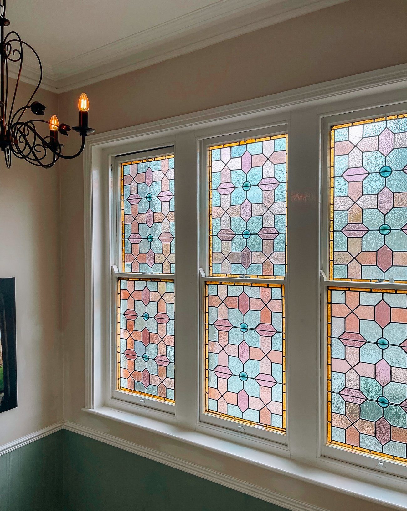 Pink and blue stained glass windows at Oxford University student housing