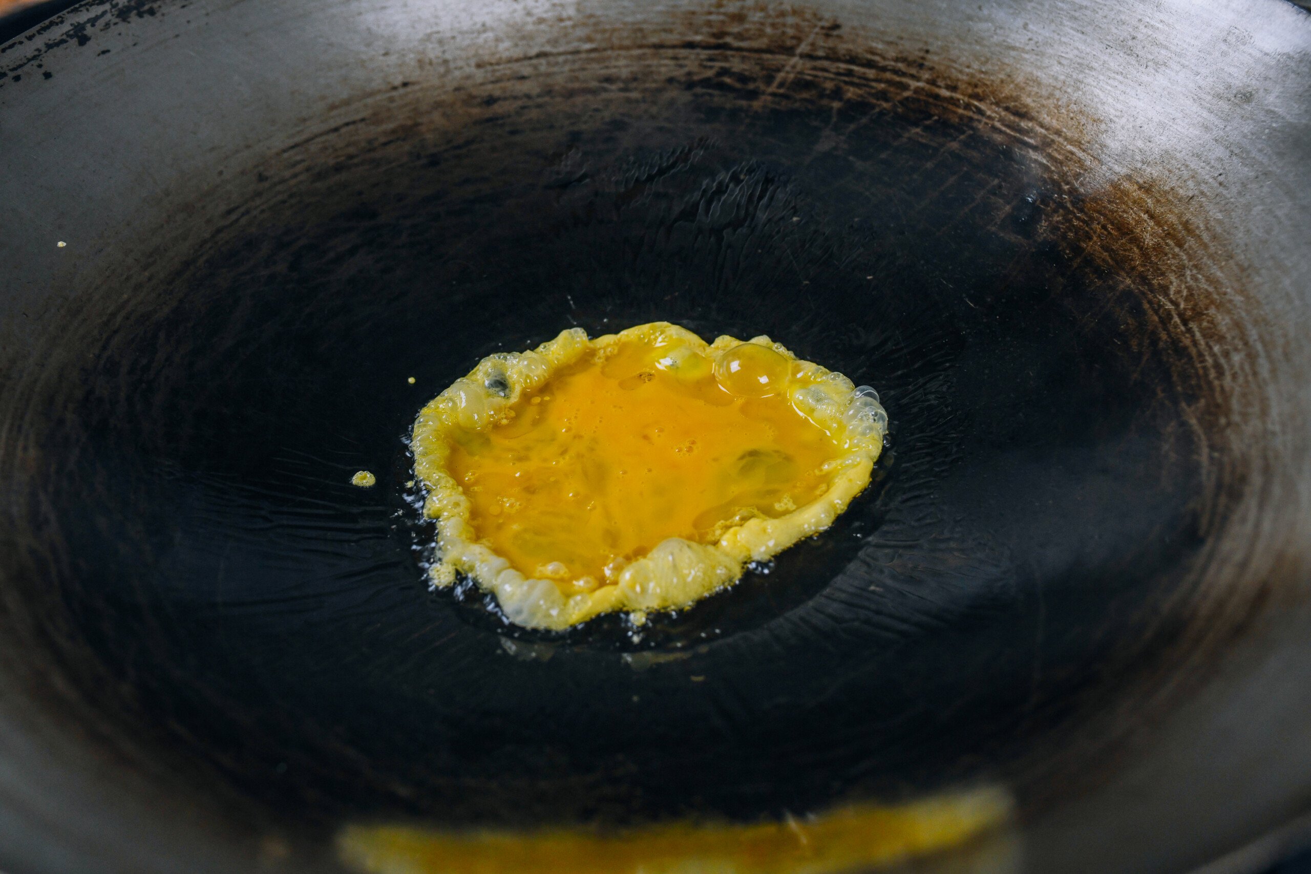 scrambling eggs in a wok