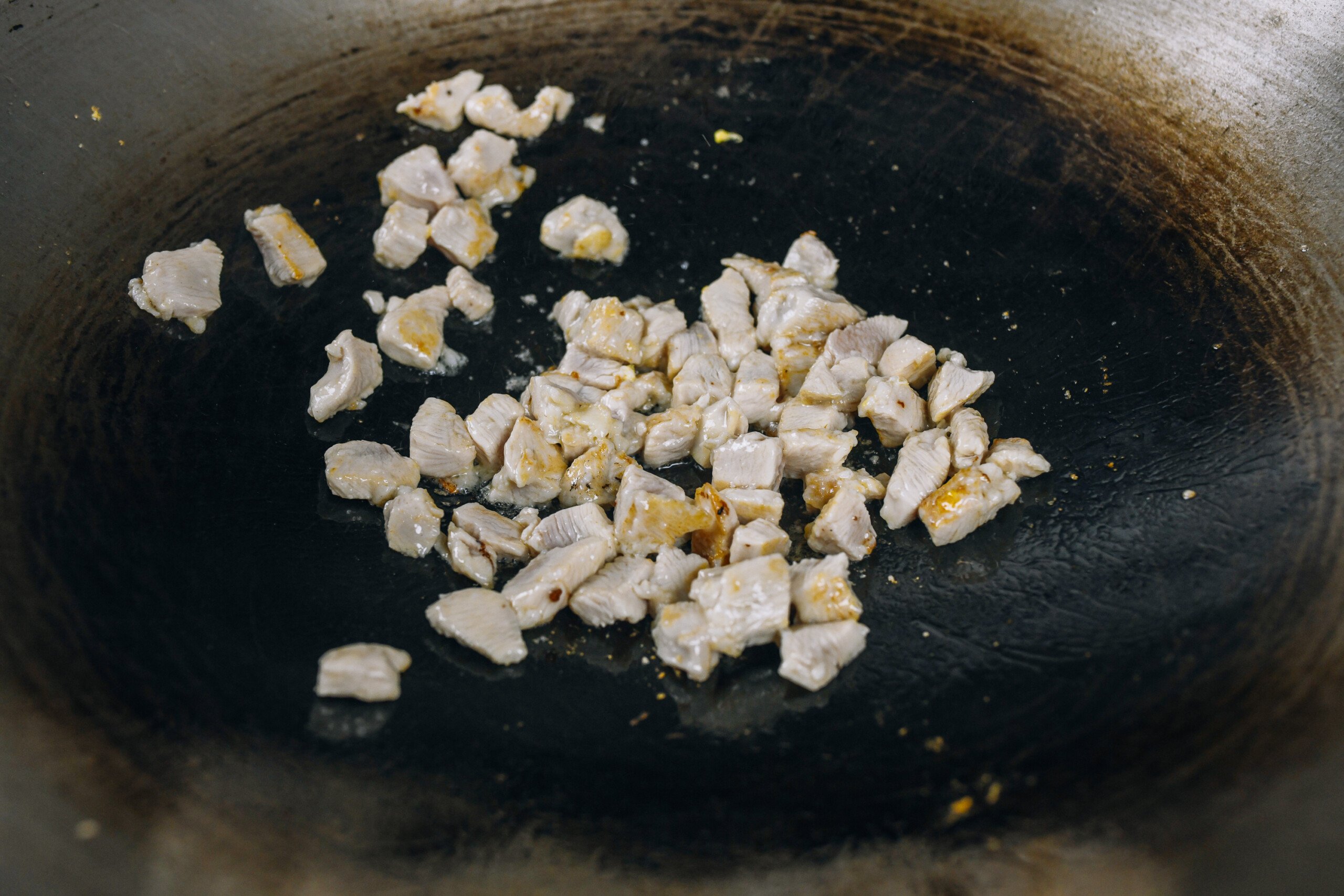 stir-frying cubed chicken breast
