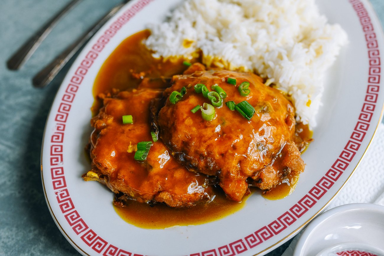 Egg Foo Young with Gravy on plate with rice