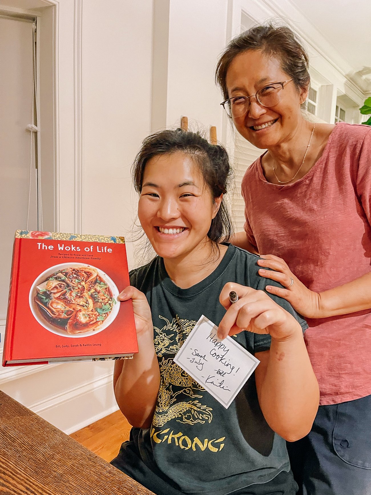 Sarah and Judy with The Woks of Life cookbook and signed book plate