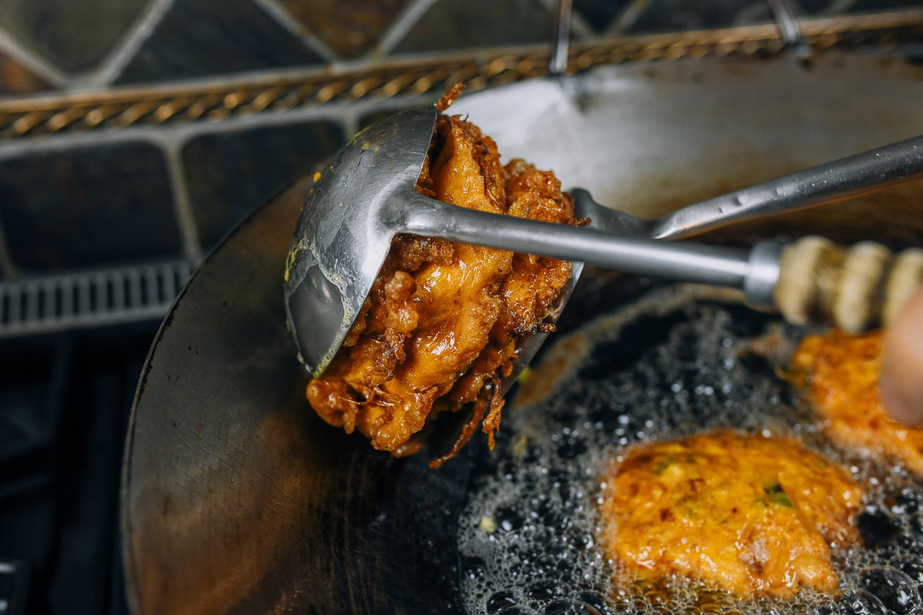 Squeezing excess oil out of egg foo young patties