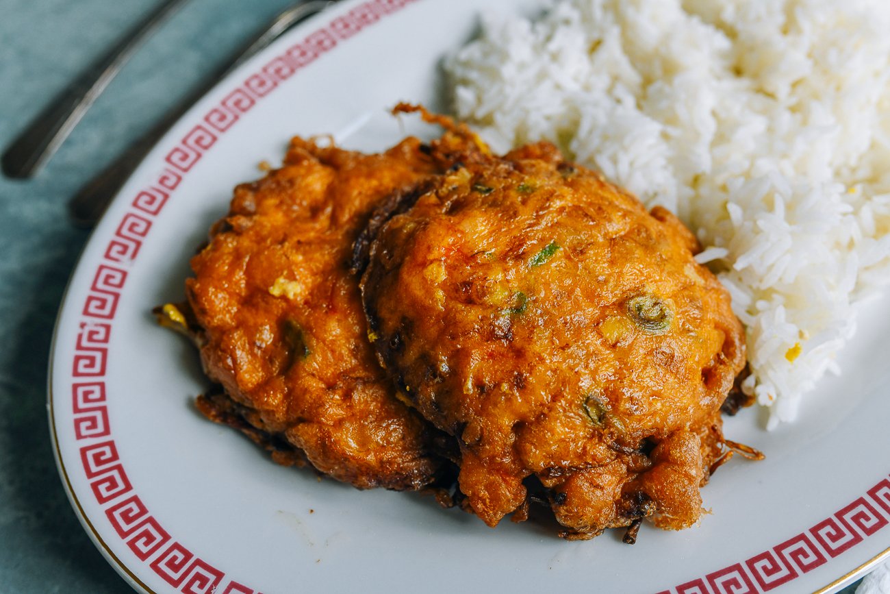 egg foo young patties on plate with white rice