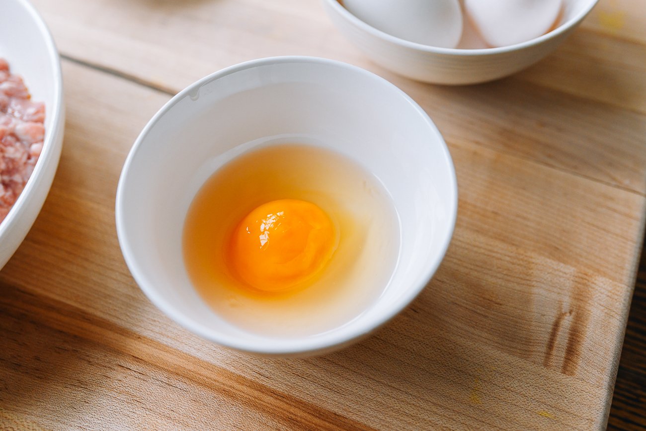 raw salted duck egg in bowl